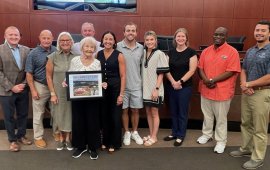 Members of the late Mayor Jim Middleton's family pose with the Mayor and Council 