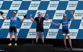Dalton firefighter Douglas Kerns (left) stands on the awards podium after finishing second in the cyclinc competition at the Mic