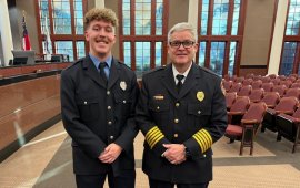 Logan Fowler (left) poses with Fire Chief Matt Daniel (right) 