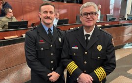 Firefighter of the Year Austin Williams (left) poses with Chief Matt Daniel after receiving the honor Tuesday 