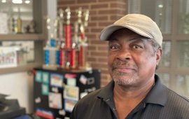 Tom Pinson poses in his office at the Mack Gaston Community Center