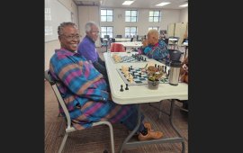Dalton senior citizens play games together at a table 
