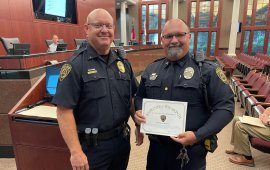 DPD Assistant Chief Chris Crossen (left) recognized MPO Sean Hudson (right) as the June 2025 Officer of the Month
