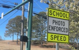 A sign near Dalton High School warns motorists that speeds are checked by speed cameras 