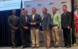 Dalton Public Works staff pose together on a stage after winning an award
