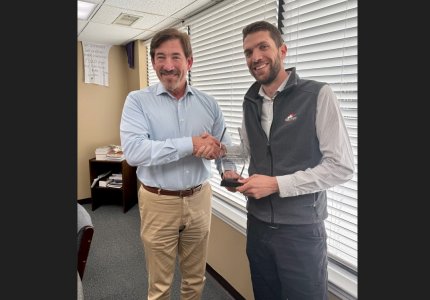 Andrew Wiersma (right) receives the James Stogner Award from Dalton Airport Authority Chairman Danny Morgan (left) 