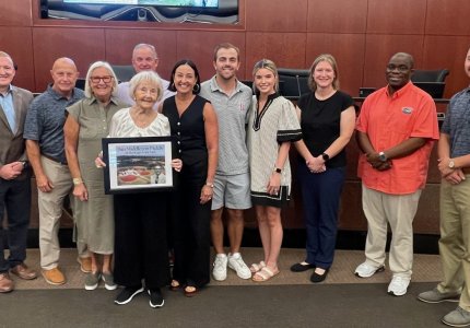 Members of the late Mayor Jim Middleton's family pose with the Mayor and Council 