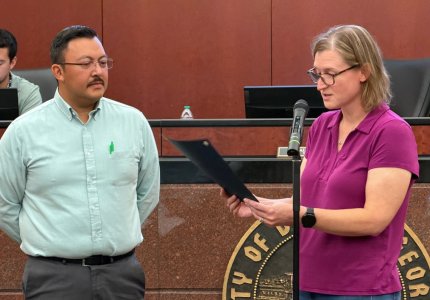 Mayor Annalee Sams reads a proclamation for Cybersecurity Awareness Month as City of Dalton IT Director Jorge Paez looks on