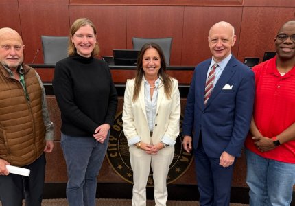 New City Councilmember Julie Locke (center) poses with the Mayor and Council 