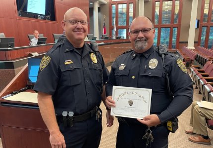 DPD Assistant Chief Chris Crossen (left) recognized MPO Sean Hudson (right) as the June 2025 Officer of the Month