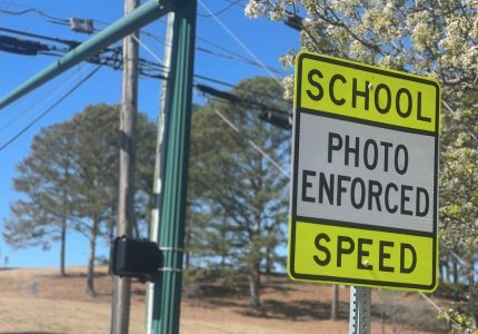 A sign near Dalton High School warns motorists that speeds are checked by speed cameras 