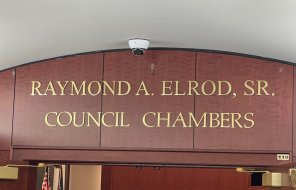 Newly unveiled signage designates the Raymond A. Elrod, Sr. Council Chambers 