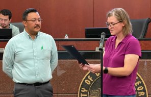 Mayor Annalee Sams reads a proclamation for Cybersecurity Awareness Month as City of Dalton IT Director Jorge Paez looks on