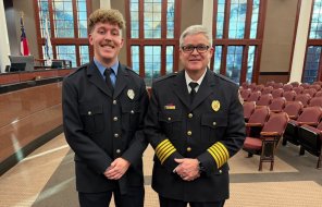 Logan Fowler (left) poses with Fire Chief Matt Daniel (right) 
