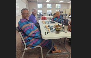 Dalton senior citizens play games together at a table 