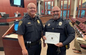 DPD Assistant Chief Chris Crossen (left) recognized MPO Sean Hudson (right) as the June 2025 Officer of the Month