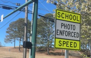 A sign near Dalton High School warns motorists that speeds are checked by speed cameras 