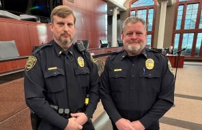 Lt. Matthew Lowery (left) poses with Chief Cliff Cason after being presented for promotion at Tuesday morning's meeting of the D