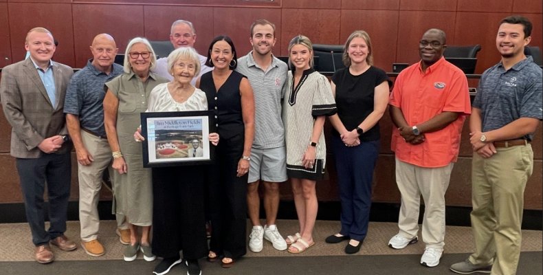 Members of the late Mayor Jim Middleton's family pose with the Mayor and Council 