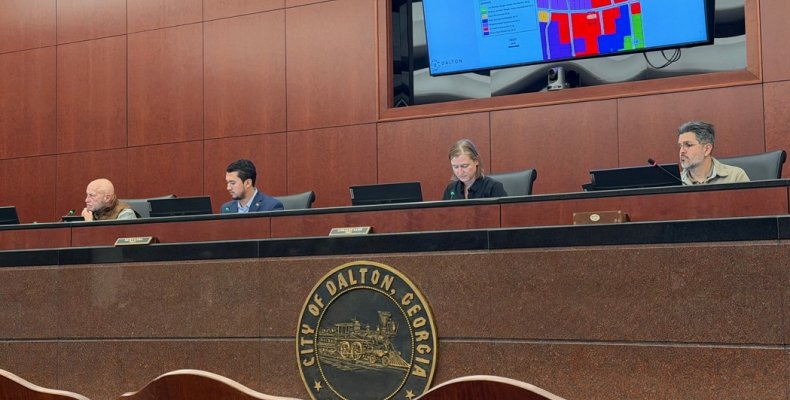 Mayor Sams and members of the City Council listen during a presentation Monday night 