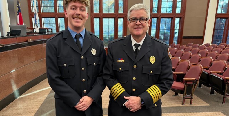 Logan Fowler (left) poses with Fire Chief Matt Daniel (right) 