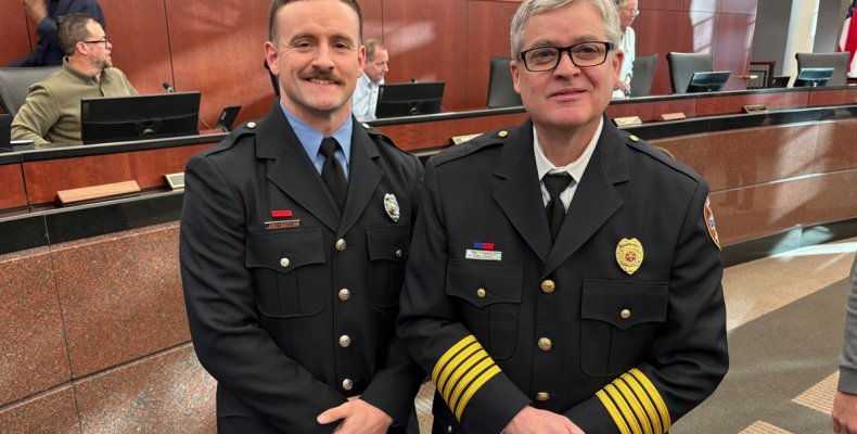 Firefighter of the Year Austin Williams (left) poses with Chief Matt Daniel after receiving the honor Tuesday 