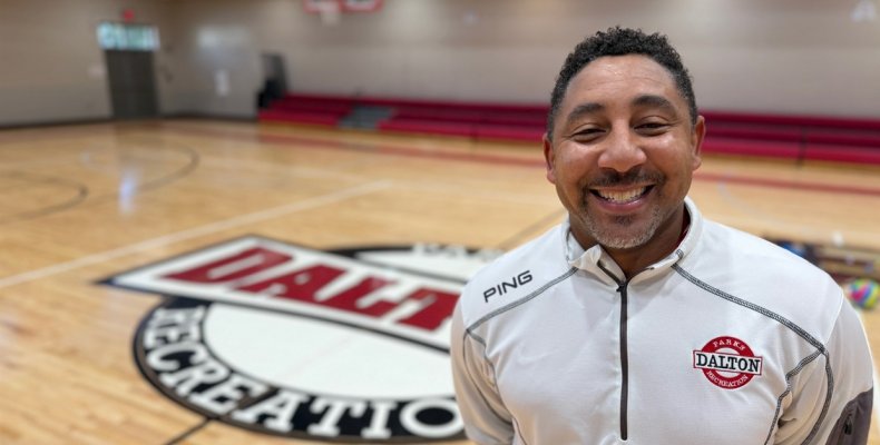 Michael Robinson stands in one of the basketball gyms at the Mack Gaston Community Center where he is the new facility director