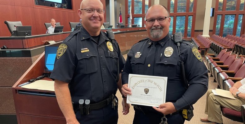 DPD Assistant Chief Chris Crossen (left) recognized MPO Sean Hudson (right) as the June 2025 Officer of the Month