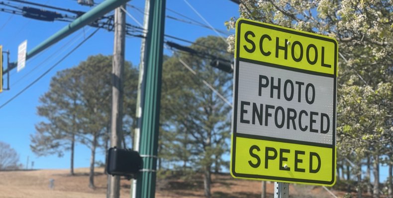 A sign near Dalton High School warns motorists that speeds are checked by speed cameras 