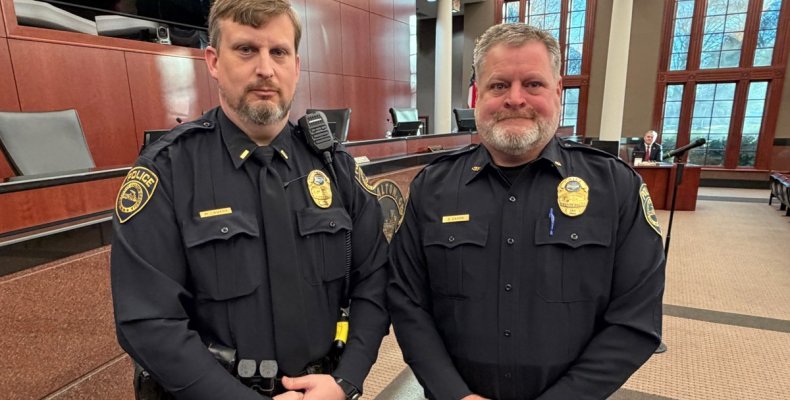 Lt. Matthew Lowery (left) poses with Chief Cliff Cason after being presented for promotion at Tuesday morning's meeting of the D