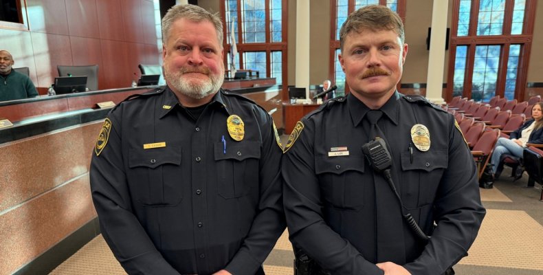 Patrick Lee (right) poses with Chief Cliff Cason after being presented for promotion at Tuesday morning's meeting of the Public 